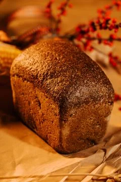 Artisan bread displayed on rustic table with decorative elements 写真素材