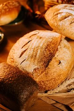 Artisan bread displayed on rustic table with decorative elements 写真素材