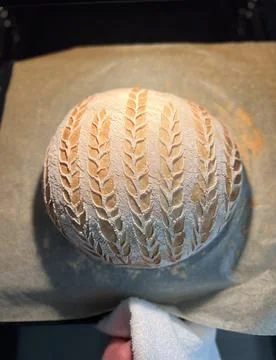 Artisan Bread Featuring an Intricate and Beautiful Scoring Design for Enhanced 스톡 사진