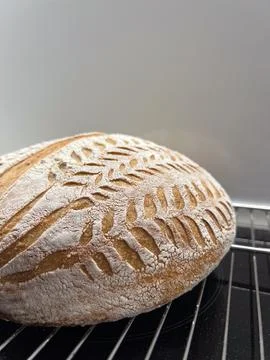 Artisan Bread Featuring Intricate Scoring Techniques Beautifully Displayed on a 스톡 사진