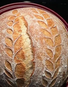 Artisan Bread Featuring a Stunning Scoring Design that Enhances Its Visual 스톡 사진