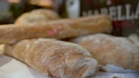 Artisan breads showcased in a charming bakery setting Stockbeeldmateriaal 281592148