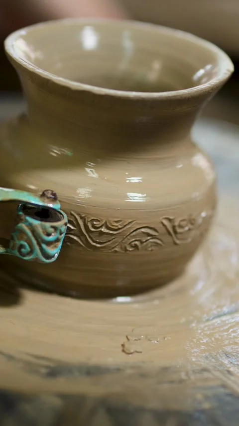 Artisan Carving Intricate Patterns on Spinning Clay Pottery in Thailand Stock Footage 341069008