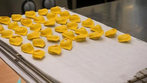 Artisan Chef Carefully Prepares Delicate Pumpkin Stuffed Fall Season Tortel.. Stock Photos