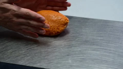 Artisan chef kneading orange dough for gallego empanada Stock-Footage 330428792