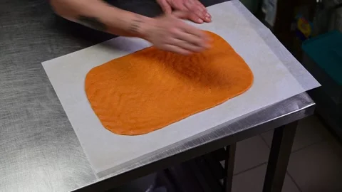 Artisan chef kneading orange dough for gallego empanada Stock-Footage 330428799