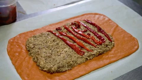 Artisan chef kneading orange dough for gallego empanada Video stock 330428899