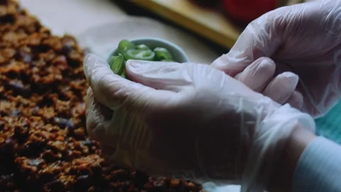 Artisan cooking view: layering avocado inside a burrito Stock Footage 342167783