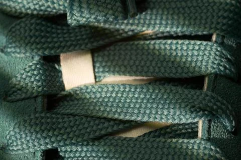 Artisan crafted cordwork pattern. Focused view of artisanal green lace brai.. Stock Photos
