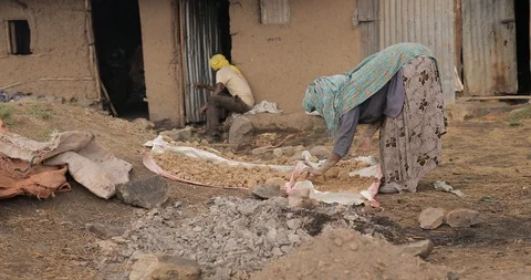 Artisan crafts workshop in Debre Barhan, Ethiopia - potters hand mixing dry Stock Footage 109173169