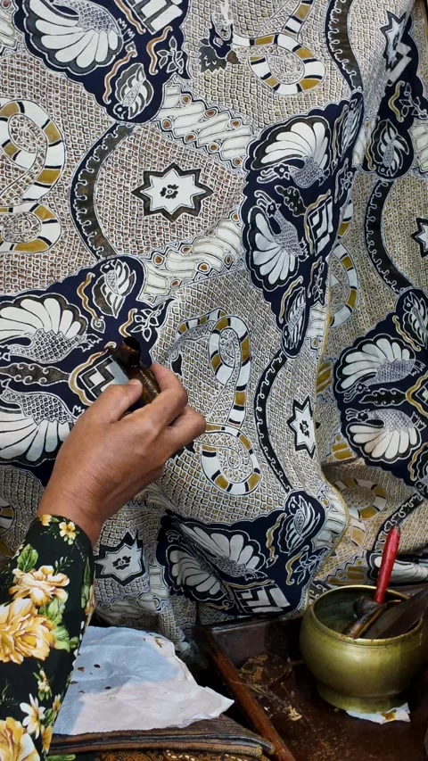Artisan Drawing Traditional Batik Patterns with Hot Wax and Canting Stock Footage 344087578