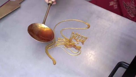 Artisan Drizzling Sugar Syrup To Form Tanghua Dragon Painting Stock Footage 338164380