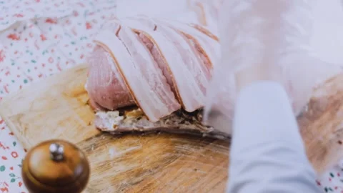 Artisan finished dish: securing a bacon wrapped tenderloin Stock Footage 342184732
