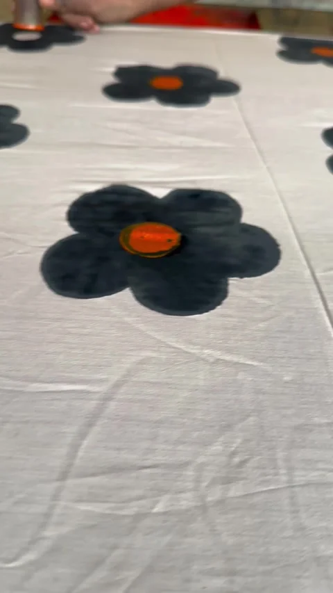 Artisan hand block printing black flower on fabric Video stock 344540669