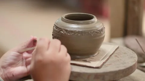 Artisan Hand Carving Decorative Patterns on Wet Clay Pot Stock Footage 347629355