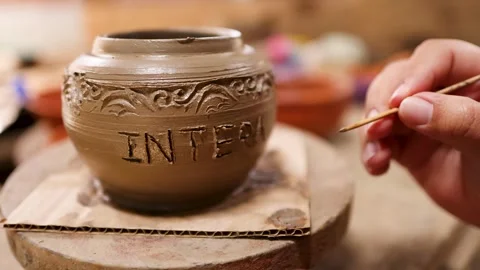Artisan Hand Carving Intricate Patterns on Traditional Clay Pottery Pot Stock Footage 340006205