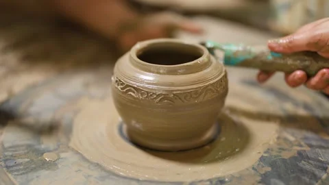 Artisan Hands Carving Intricate Patterns on Clay Pot in Nonthaburi Stock Footage 341302651
