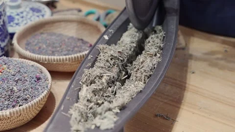 Artisan Hands Chopping Dried Herbs with Traditional Chinese Rocking Blade Knife Stock Footage 335080811