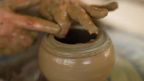 Artisan Hands Shaping Clay Pot on Spinning Pottery Wheel Stock Footage 341305695