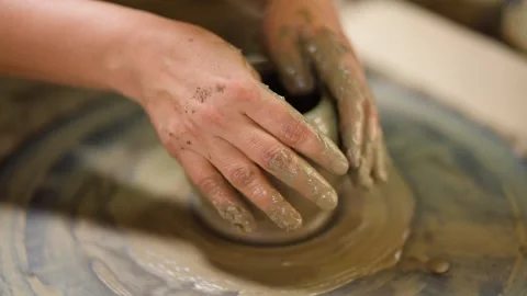 Artisan Hands Shaping Clay Pot on Spinning Pottery Wheel Stock Footage 341537923