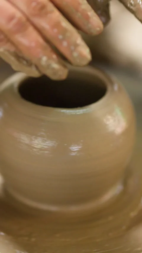 Artisan Hands Shaping Clay Pot on Spinning Pottery Wheel Stock Footage 341642918