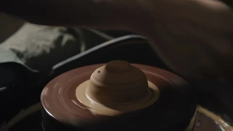 Artisan hands shaping clay on a potter's wheel in slow motion Stock Footage 168536909