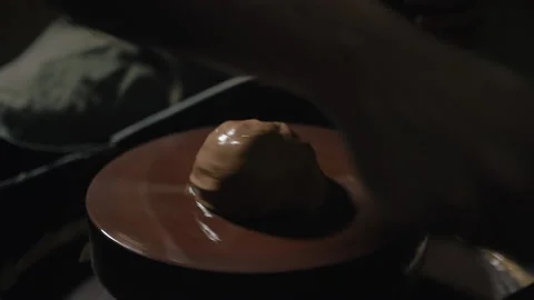 Artisan hands shaping clay on a potter's wheel in slow motion Stock Footage 168537008