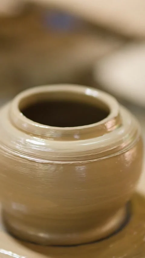 Artisan Hands Shaping Wet Clay Pot on Spinning Pottery Wheel Stock Footage 341374005