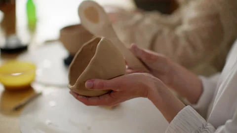 Artisan Hands Skillfully Shaping Clay Pot on Potter's Wheel in Workshop Stock Footage 271150037