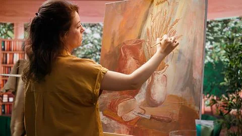 Artisan inspired by natural rural elements to paint a masterpiece on canvas Stock Photos