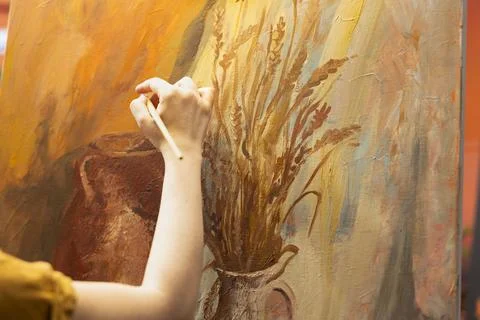 Artisan inspired by natural rural elements to paint a masterpiece on canvas Stock Photos