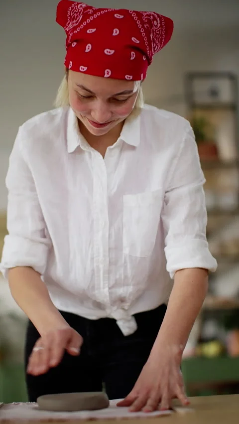 Artisan with Joyful Expression Molding Clay on Table in Creative Pottery Video stock 271155488