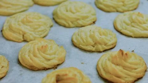 Artisan kitchen technique: baking duchess potatoes until golden Stock Photos