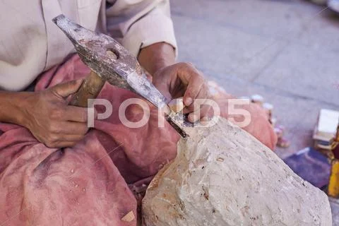 Artisan makes pieces for mosaic craftwork Stock Photos