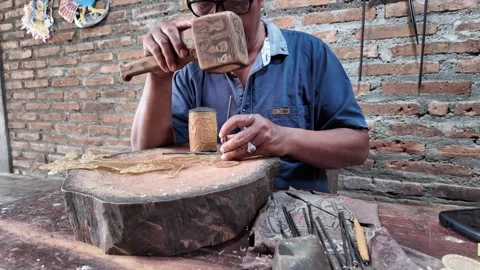Artisan Man making Traditional Javanese wayang golek wooden puppets Stock Footage 337194230