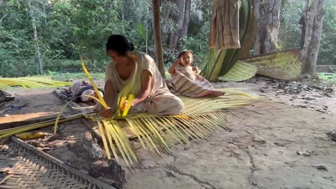 An artisan meticulously weaving intricate patterns with vibrant materials Stock Footage 316177791
