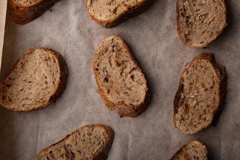 Artisan Multi-Grain Bread Slices on Baking Paper Stock Photos
