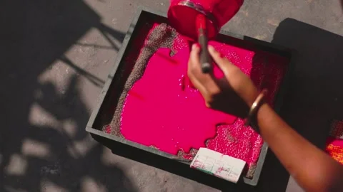 Artisan Pouring Pink Paint into Block Printing Machine, Close-Up 4K Video Stock Footage 320930443