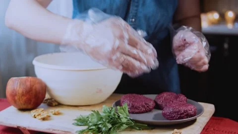 Artisan preparation close-up: pressing walnut garnish into each portion Stock Footage 342200271