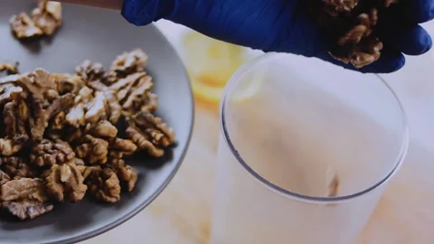 Artisan professional food view: grinding walnuts for satsivi sauce Stock Footage 342201447