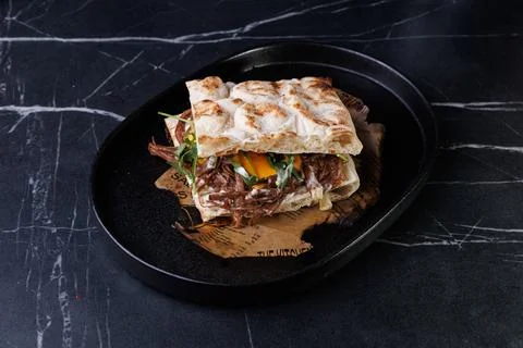 Artisan Pulled Pork Sandwich With Egg, Greens, And Flatbread Stock Photos