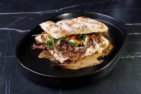 Artisan Pulled Pork Sandwich With Egg, Greens, And Flatbread Stock Photos