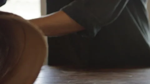 Artisan rolling up leather materials Stock Footage 67849541