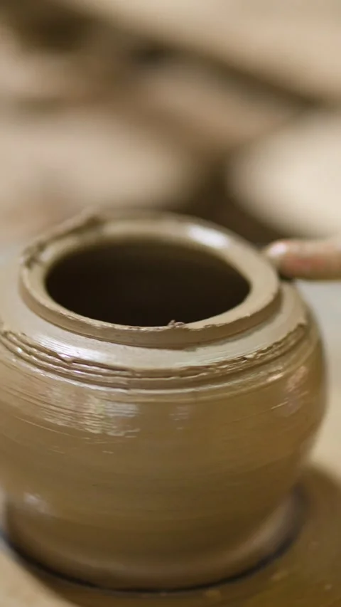 Artisan Shaping Clay Pot on Spinning Pottery Wheel in Nonthaburi Stock Footage 341305724
