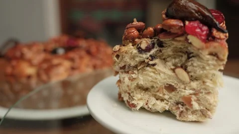 Artisan sweet bread with nuts and berries. New Year's cake. Sweet cake Video stock 313800137