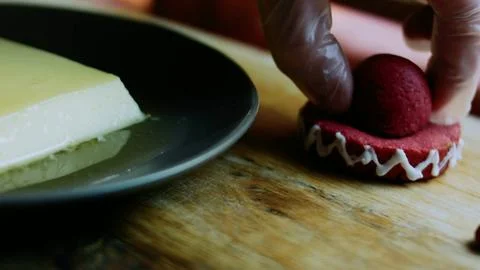 Artisan tabletop study of placing a red miniature sombrero over the flan Stock Photos