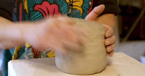 The artisan touch: a close-up of a pair of hands moulding Stock Footage 329311299