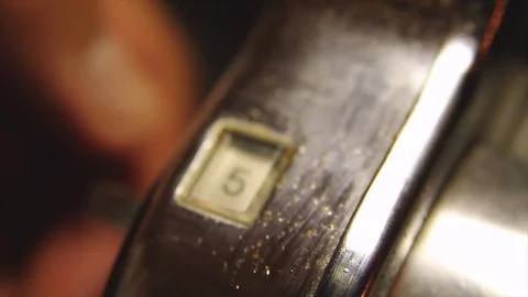 Artisan is turning the numbers on handle Stock Footage 102178623