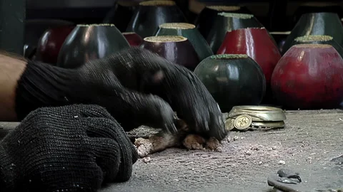 Artisan Using Borax Paste in Metalwork Process for Traditional Mate Gourds - 4K Stock Footage 320852390
