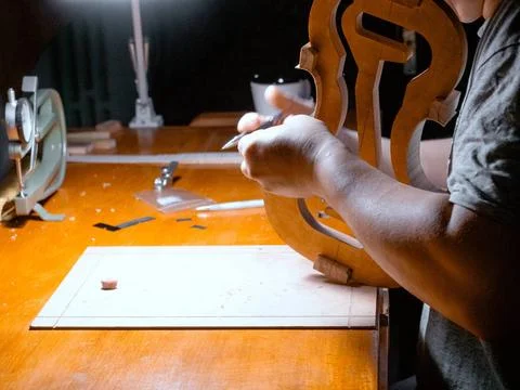 Artisan violin maker luthier working with violin mould for center bot, cor... Stock Photos
